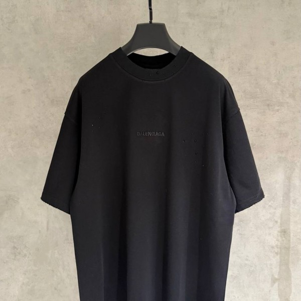 BALENCIAGA MODEL IN BLACK WITH COLD-PRESSED PRINTED TEXT ON IT