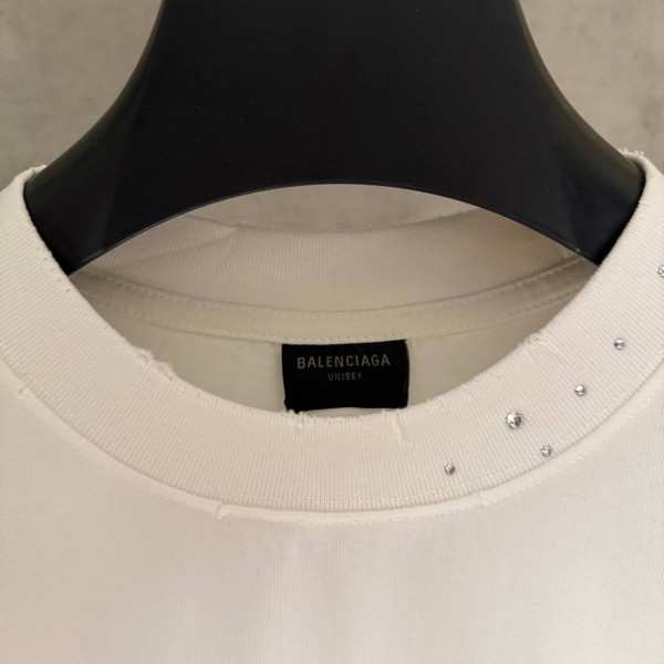 BALENCIAGA MODEL WITH COLD-PRESSED TEXT ON IT 4