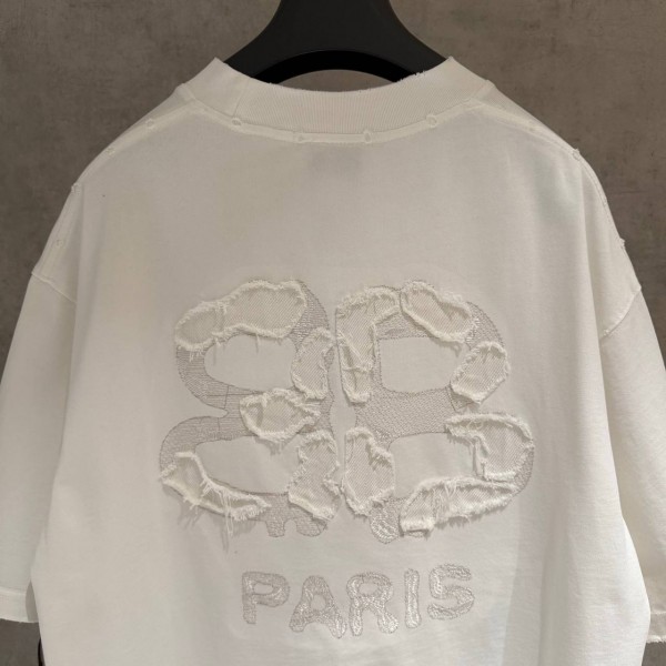 BALENCIAGA WHITE, WITH WHITE WRITING ON IT. 5