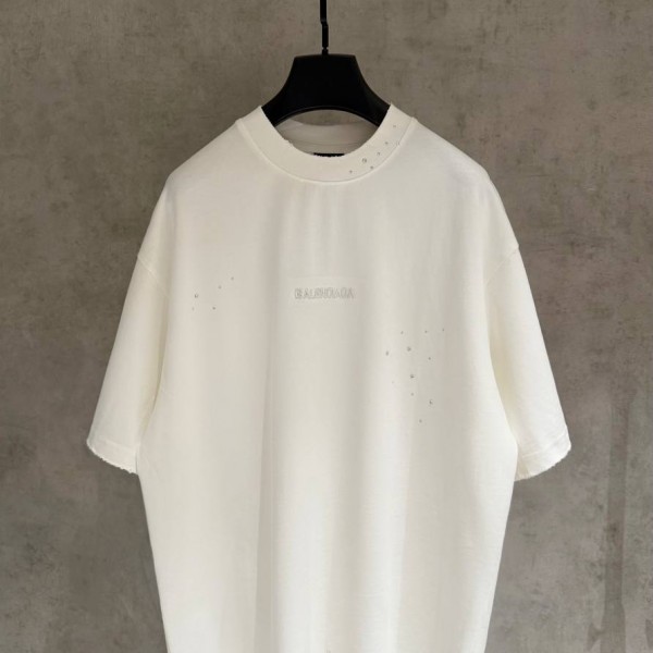 BALENCIAGA MODEL WITH COLD-PRESSED TEXT ON IT