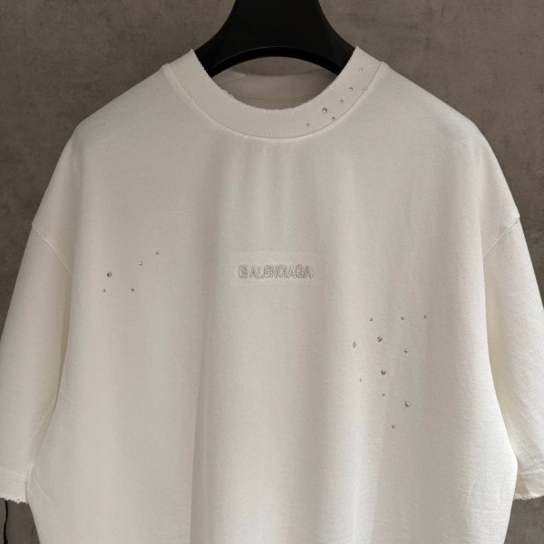 BALENCIAGA MODEL WITH COLD-PRESSED TEXT ON IT 3