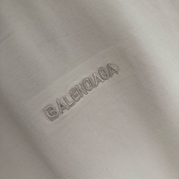 BALENCIAGA MODEL WITH COLD-PRESSED TEXT ON IT 5