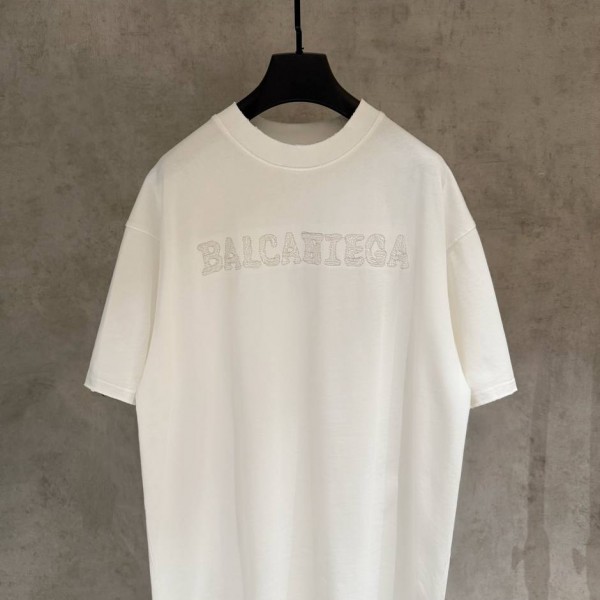 BALENCIAGA WHITE, WITH WHITE WRITING ON IT.