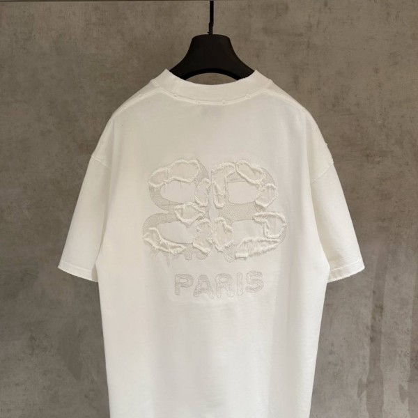 BALENCIAGA WHITE, WITH WHITE WRITING ON IT. 2