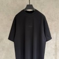 BALENCIAGA MODEL IN BLACK WITH COLD-PRESSED PRINTED TEXT ON IT 1