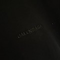 BALENCIAGA MODEL IN BLACK WITH COLD-PRESSED PRINTED TEXT ON IT 4